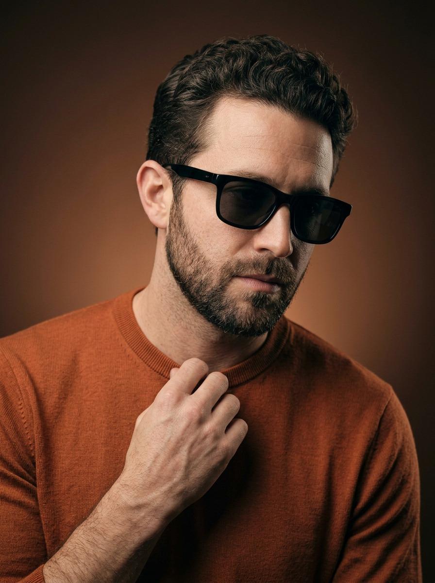 Stylish Man in Burnt Orange Crewneck and Black Sunglasses